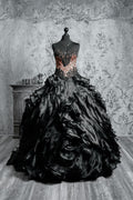 Luxury alternative bride gown showcasing cascading black fabric layers, Victorian fashion influences and a dark vampire aesthetic