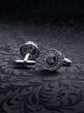 Imperial Violet cufflinks featuring a large central purple crystal surrounded by a halo of small white stones on a dark background.
