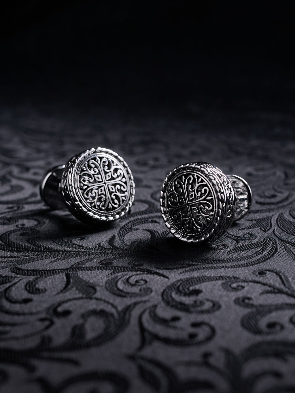 Front view of Baroque Crest metal cufflinks with intricate gothic pattern and antique silver finish