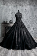 Black gothic wedding dress with strapless sweetheart corset, heavily embroidered lace bodice and voluminous glitter tulle ballgown skirt