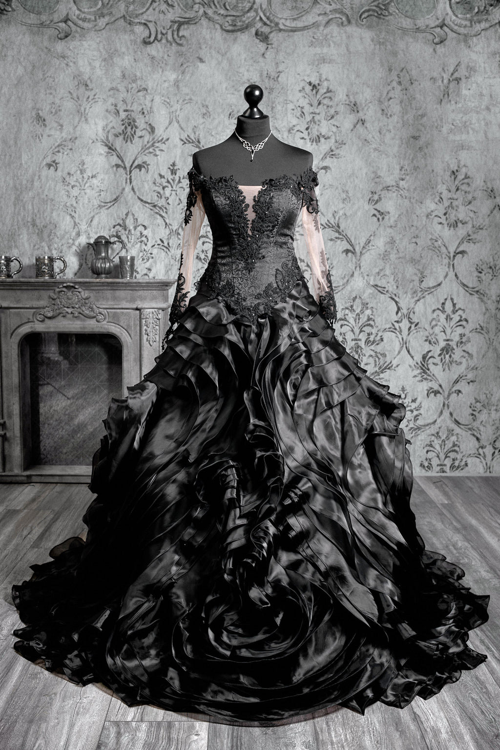 Black gothic wedding ballgown with sheer illusion long sleeves, sweetheart lace bodice and voluminous glitter tulle skirt with lace appliqué and cathedral train