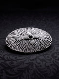 Angled view of the Black Halo metal buckle, showing the depth of the engraved patterns and the antique oxidized effect