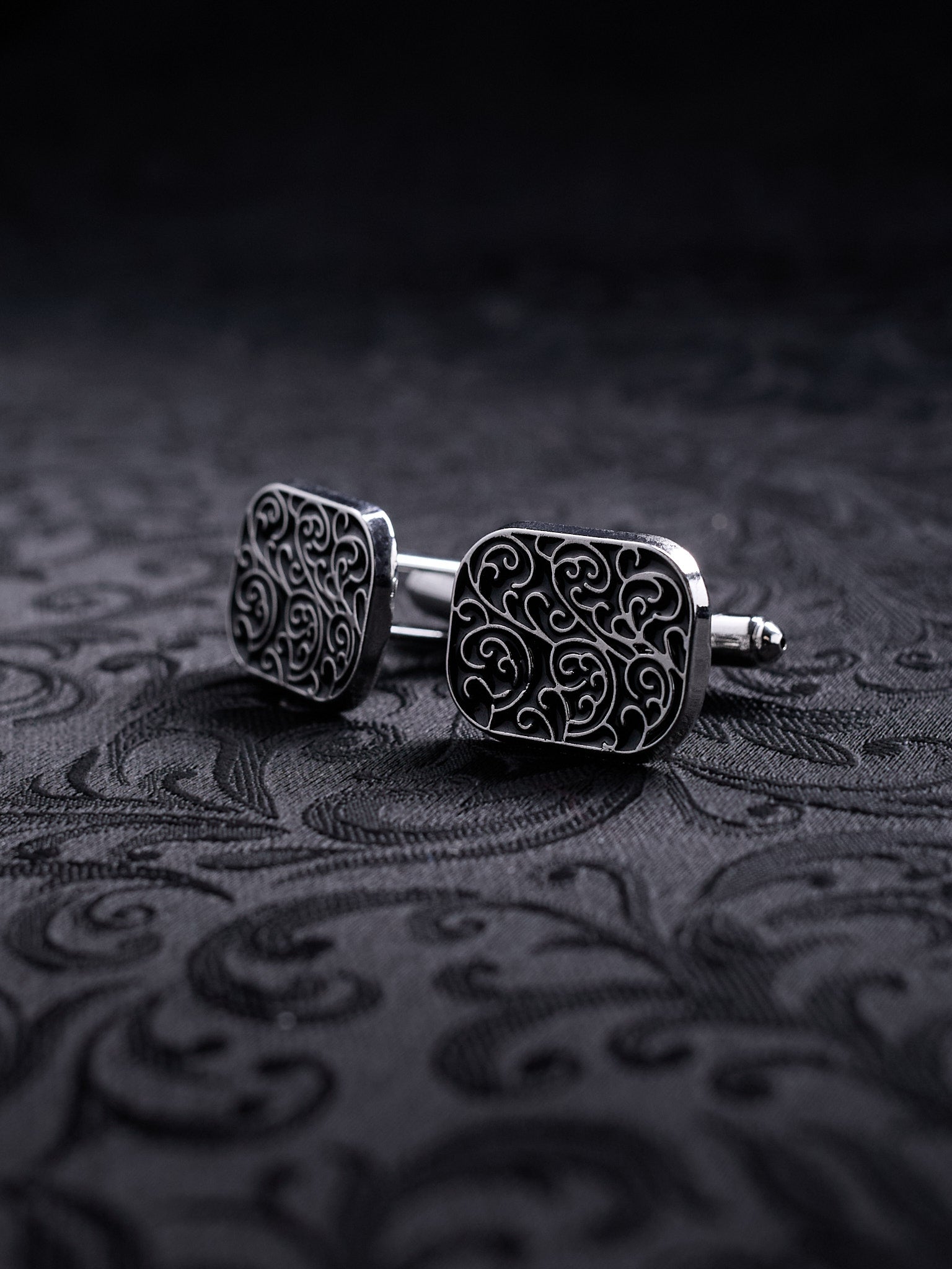 Side view of the Ornamented Gothic cufflinks showing the intricate silver-tone etching and the classic toggle closure