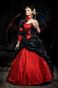 Red and black gothic Victorian wedding ballgown with military-style black jacket, red brocade corset bodice, ruched black overskirt and voluminous red brocade skirt