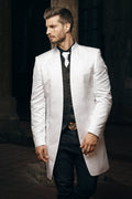 Men's white long brocade frock coat with stand collar, paired with black brocade vest, ornate belt buckle and black tie for alternative groom wedding outfit