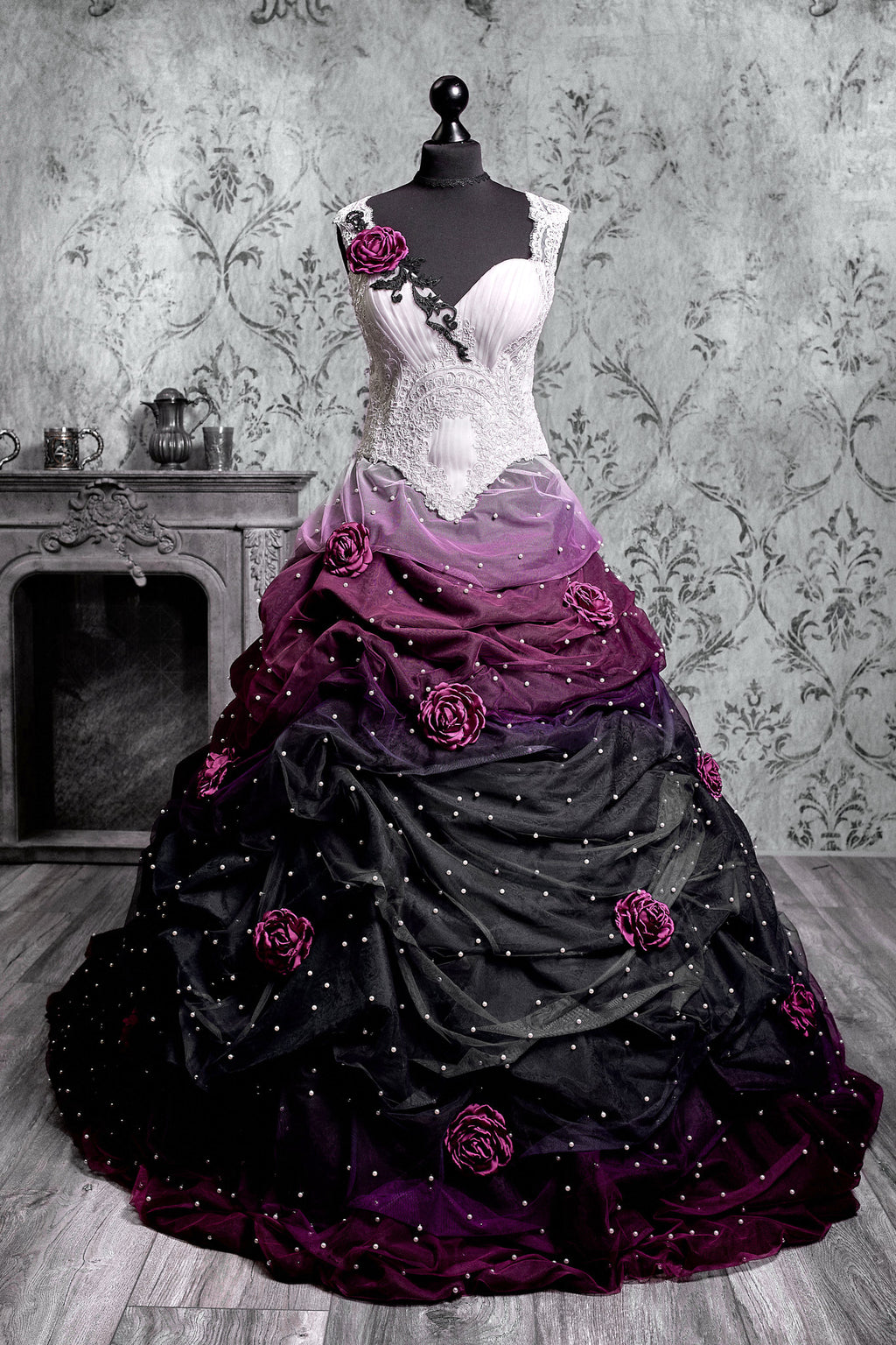 Gothic wedding ballgown with white lace corset bodice transitioning into purple and black ombre ruched tulle skirt, scattered pearl beading and handcrafted magenta roses throughout